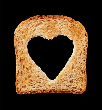 simsearch:400-05701644,k - Food and health concept - bread slice with heart shaped hole - isolated on black Stock Photo - Budget Royalty-Free & Subscription, Code: 400-07818003