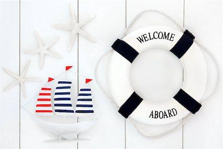 simsearch:400-07818974,k - Abstract of seaside decorative sailing boat, lifebuoy and starfish over wooden white background. Stock Photo - Budget Royalty-Free & Subscription, Code: 400-07818426