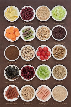 simsearch:400-08429907,k - Large diet health food selection in porcelain bowls over lokta paper background. With titles. Fotografie stock - Microstock e Abbonamento, Codice: 400-07818420