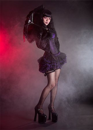 Gothic Lolita girl with lace umbrella, studio shot on black background Stockbilder - Microstock & Abonnement, Bildnummer: 400-07818694
