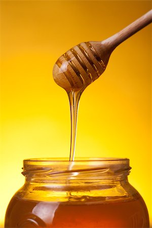 simsearch:400-06640106,k - Studio shot of wooden dipper with flowing honey over yellow background Stock Photo - Budget Royalty-Free & Subscription, Code: 400-07818696