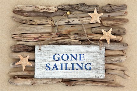 simsearch:400-07818974,k - Starfish and gone sailing old weathered sign on driftwood and beach sand background. Stock Photo - Budget Royalty-Free & Subscription, Code: 400-07818972