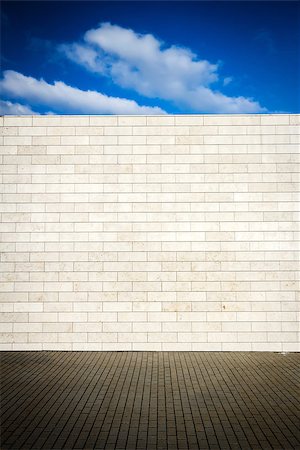 empty street wall - Tiled wall with blank stone bricks and a sky Stock Photo - Budget Royalty-Free & Subscription, Code: 400-07818990
