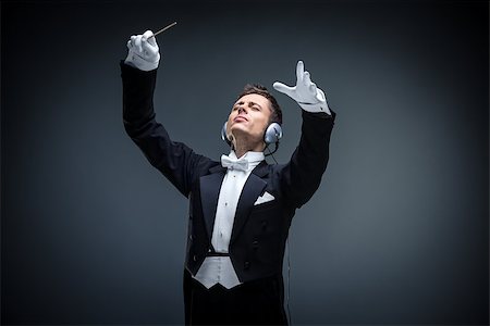 Young man in tuxedo conducting Stock Photo - Budget Royalty-Free & Subscription, Code: 400-07819072