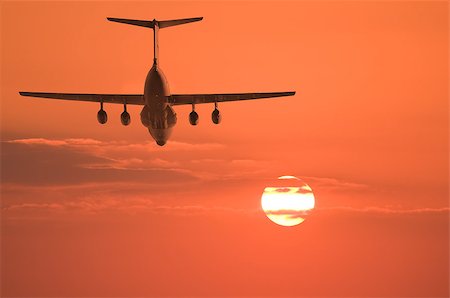 Flight of the cargo plane on the sunset background. Stock Photo - Budget Royalty-Free & Subscription, Code: 400-07819133