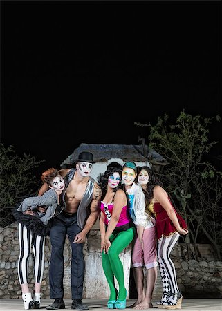 Clown ensemble posing on outdoor theater stage Fotografie stock - Microstock e Abbonamento, Codice: 400-07819385