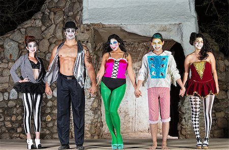 Group of mixed cirque clowns bowing on stage Fotografie stock - Microstock e Abbonamento, Codice: 400-07819381