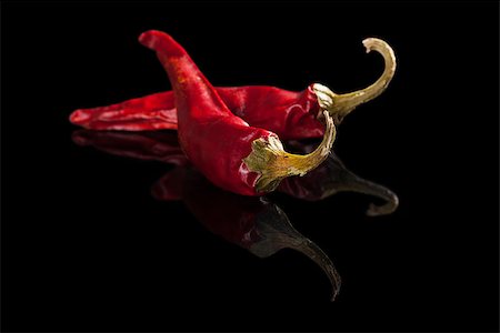 simsearch:400-07211737,k - Dry chili pepper isolated on black background. Culinary hot cooking ingredients. Photographie de stock - Aubaine LD & Abonnement, Code: 400-07819574
