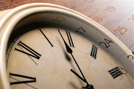 simsearch:700-03660003,k - clock face with sheet of a calendar with the number of days close up Stock Photo - Budget Royalty-Free & Subscription, Code: 400-07819588