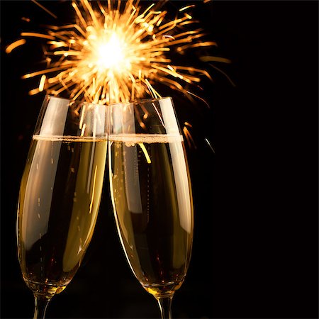 Beautiful golden champagne with sparklers on black background - square Stock Photo - Budget Royalty-Free & Subscription, Code: 400-07819720