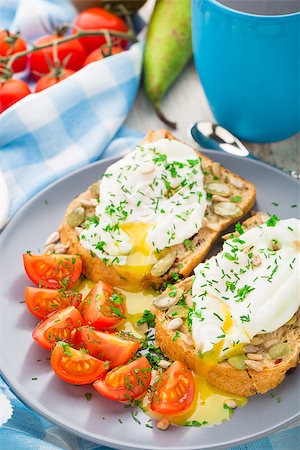 eat boiled egg - Breakfast sandwich with poached egg and cherry tomatoes. Stock Photo - Budget Royalty-Free & Subscription, Code: 400-07819745