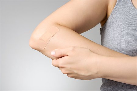 skin treatment medical - Female arm with adhesive bandage Stock Photo - Budget Royalty-Free & Subscription, Code: 400-07824013