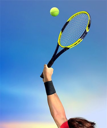 simsearch:400-06061549,k - Man Making a Tennis Serve Photographie de stock - Aubaine LD & Abonnement, Code: 400-07824777