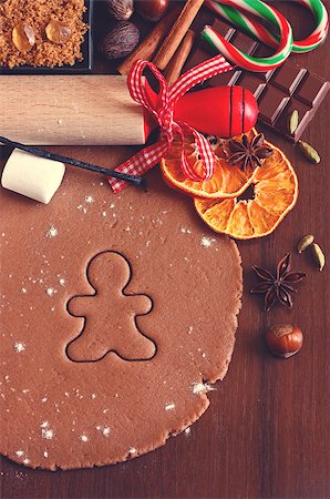 simsearch:400-06430094,k - Preparation for baking Christmas cookies. Gingerbread dough with spices gingerbread man cookie and rolling pin. Toned photo. Stock Photo - Budget Royalty-Free & Subscription, Code: 400-07824827