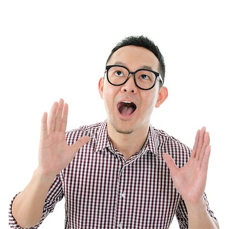 simsearch:400-04639378,k - Portrait of Asian male get shocked and looking up isolated on white background. Stock Photo - Budget Royalty-Free & Subscription, Code: 400-07825049