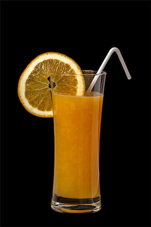 a glass of orange juice on a black background Photographie de stock - Aubaine LD & Abonnement, Code: 400-07825348