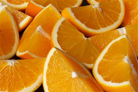 segments of oranges on the black background Photographie de stock - Aubaine LD & Abonnement, Code: 400-07825349