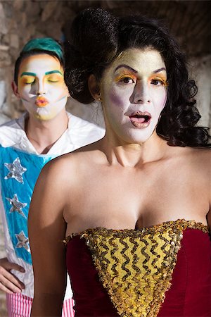 Embarrassed female cirque clown and man blowing kisses Fotografie stock - Microstock e Abbonamento, Codice: 400-07825494