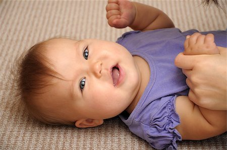 Caucasian smiling baby portrait lying on carpet Foto de stock - Royalty-Free Super Valor e Assinatura, Número: 400-07826017