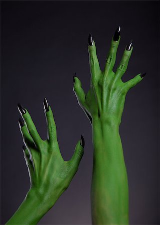 Green monster hands with black nails stretching up, real body-art, Halloween theme Stock Photo - Budget Royalty-Free & Subscription, Code: 400-07826706