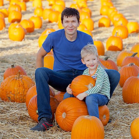 simsearch:400-07916492,k - happy family of two having fun at pumpkin patch Stock Photo - Budget Royalty-Free & Subscription, Code: 400-07828223
