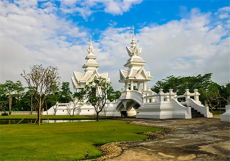 Wat Rong Khun in Chiang Rai, Thailand, the beautiful temple is integration of traditional Thai architecture and the surreal, more well-known of foreigners as the "White Temple". Stock Photo - Budget Royalty-Free & Subscription, Code: 400-07828262
