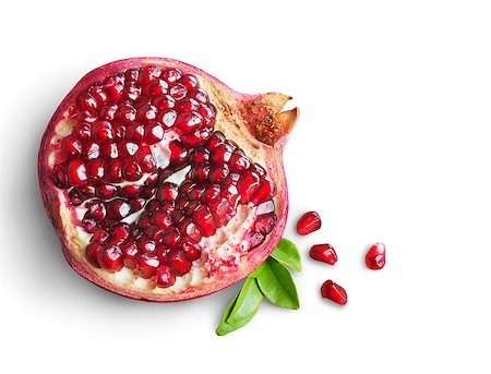 simsearch:400-06457388,k - Juicy pomegranate fruit isolated on white background Photographie de stock - Aubaine LD & Abonnement, Code: 400-07828558