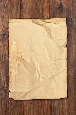 schatzkarte - old paper sheet on brown aged wood background Stockbilder - Microstock & Abonnement, Bildnummer: 400-07828806