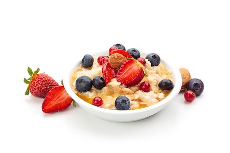 porridge and berries - Oatmeal  and fresh fruits isolated on white background. Stock Photo - Budget Royalty-Free & Subscription, Code: 400-07828892