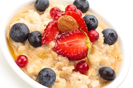 porridge and berries - Oatmeal  and fresh fruits isolated on white background. Stock Photo - Budget Royalty-Free & Subscription, Code: 400-07828893