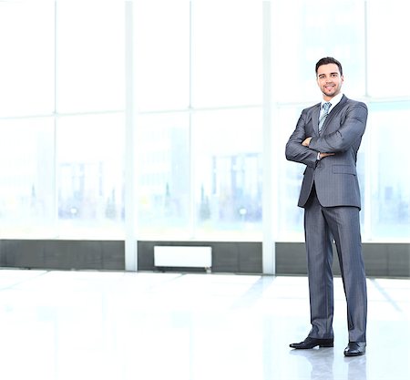 Full body portrait of young happy smiling cheerful business man Stock Photo - Budget Royalty-Free & Subscription, Code: 400-07829350