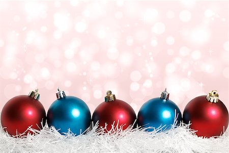 blue and red Christmas balls on the pink background with bokeh on it Stock Photo - Budget Royalty-Free & Subscription, Code: 400-07829534