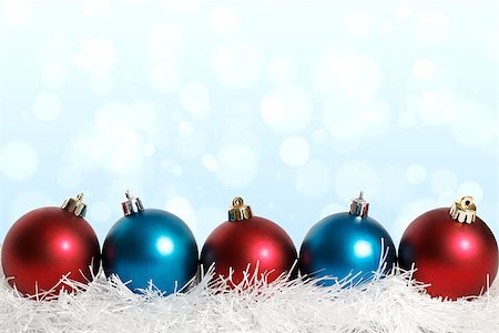 blue and red Christmas balls on the blue background with bokeh on it Stockbilder - Microstock & Abonnement, Bildnummer: 400-07829531