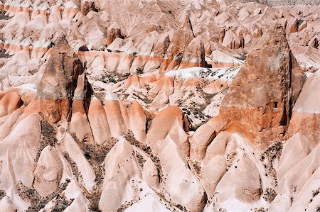 Detailed photo of vivid pink rock formations with caves from above in Cappadocia, Turkey Foto de stock - Super Valor sin royalties y Suscripción, Código: 400-07829652