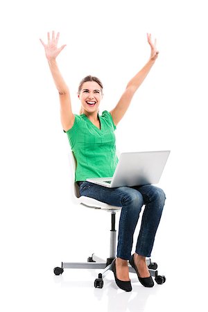 Beautiful and happy female student sitting on a chair with a laptop and arms up, isolated over a white background Foto de stock - Super Valor sin royalties y Suscripción, Código: 400-07820188