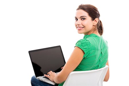 Beautiful female student sitting on a chair with a laptop, isolated over a white background Stock Photo - Budget Royalty-Free & Subscription, Code: 400-07820189