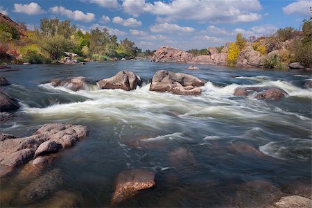 simsearch:400-06767512,k - Beautiful sunny Autumn Day on The River with waterfall and big rocks, flowing water Foto de stock - Royalty-Free Super Valor e Assinatura, Número: 400-07820278