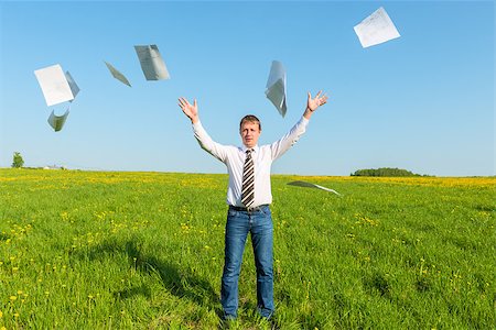 businessman in a tie throwing papers in the field Stock Photo - Budget Royalty-Free & Subscription, Code: 400-07820510