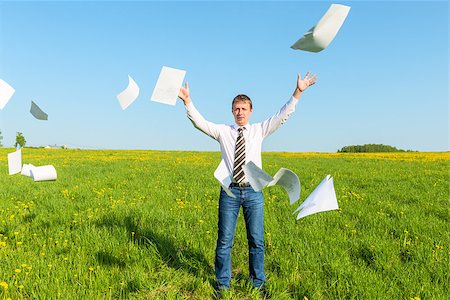 successful businessman threw papers in the field Stock Photo - Budget Royalty-Free & Subscription, Code: 400-07820511