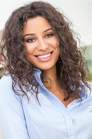 simsearch:400-07920877,k - Studio portrait of a beautiful young Latina Hispanic woman smiling Stock Photo - Budget Royalty-Free & Subscription, Code: 400-07820963
