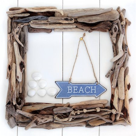 simsearch:400-07818974,k - Driftwood frame and beach sign with cockle shells over wooden white background. Stock Photo - Budget Royalty-Free & Subscription, Code: 400-07821010