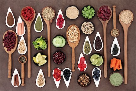 simsearch:400-08429907,k - Large diet and weight loss superfood selection in bowls and spoons over lokta paper background. Fotografie stock - Microstock e Abbonamento, Codice: 400-07821042