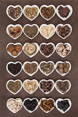 Large chinese herbal medicine selection in heart shaped porcelain bowls over lokta paper background. Stock Photo - Budget Royalty-Free & Subscription, Code: 400-07821086