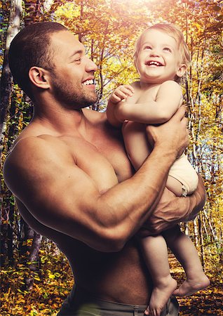 Loving father with daughter against forest background Stock Photo - Budget Royalty-Free & Subscription, Code: 400-07821538