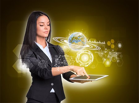 simsearch:400-07895693,k - Beautiful businesswomen in suit using digital tablet. Earth with network, graphs and circles. Element of this image furnished by NASA Stock Photo - Budget Royalty-Free & Subscription, Code: 400-07821699