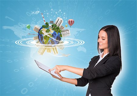 simsearch:400-07821752,k - Beautiful businesswomen in suit using digital tablet. Earth with buildings, air balloons and airplanes. Element of this image furnished by NASA Foto de stock - Royalty-Free Super Valor e Assinatura, Número: 400-07821796