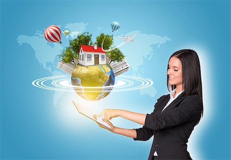 Beautiful businesswomen in suit using digital tablet. Earth with house, buildings, air balloons, trees and airplane. Element of this image furnished by NASA Stock Photo - Budget Royalty-Free & Subscription, Code: 400-07821804
