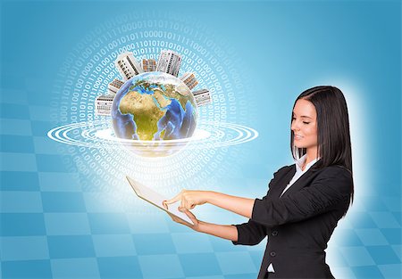 simsearch:400-07895693,k - Beautiful businesswomen in suit using digital tablet. Earth with buildings. Element of this image furnished by NASA Stock Photo - Budget Royalty-Free & Subscription, Code: 400-07821835