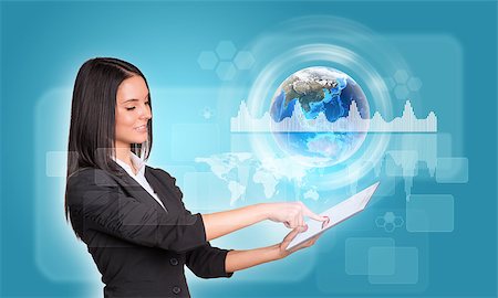 simsearch:400-07895693,k - Beautiful businesswomen in suit using digital tablet. Earth with graphs, circles and rectangles. Element of this image furnished by NASA Stock Photo - Budget Royalty-Free & Subscription, Code: 400-07821844