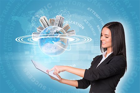 simsearch:400-07895693,k - Beautiful businesswomen in suit using digital tabletEarth with buildings and business words. Element of this image furnished by NASA Stock Photo - Budget Royalty-Free & Subscription, Code: 400-07821842